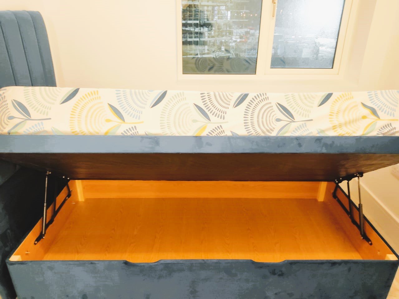 Open grey velvet ottoman bed with storage and patterned mattress – Ghar.ie property listing